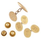 A pair of 18ct. gold cufflinks, each composed of oval panels, one with engraved 'G' beneath a