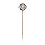 A diamond and synthetic sapphire stick pin, the rose-cut diamond quatrefoil cluster with central