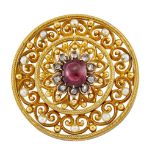 A 19th century Russian gold, diamond and spinel circular brooch, the central cabochon cushion-shaped