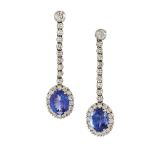 A pair of 18ct. gold, tanzanite and diamond earpendants, each designed as a single oval mixed-cut