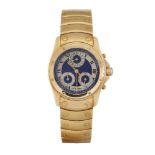 An 18ct gold chronograph date 'Santos' quartz wristwatch by Cartier, the circular blue dial with