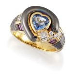 A sapphire, ruby and diamond ring, the central heart shaped sapphire collet within a black