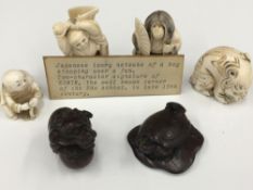 A collection of late 19th/early 20th century carved ivory and wood netsuke