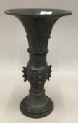 A 19th century Chinese patinated bronze vase