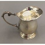 A silver cream jug (3.