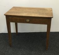 An early 20th century oak single drawer table