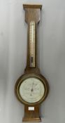 An oak cased banjo barometer