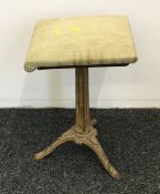 A 19th century cast iron revolving stool