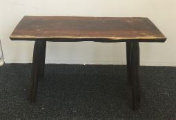 A rustic plank top table