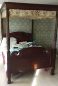 An Edwardian mahogany four poster bed