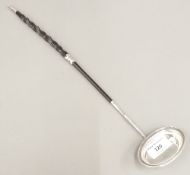 An unmarked silver and baleen toddy ladle