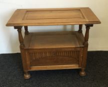 A carved oak monks bench