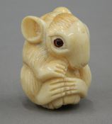 A bone netsuke formed as a rat