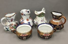 Four large Masons Ironstone wash jugs and two chamber pots