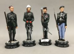 Four Michael Sutty porcelain figures of Gurkhas