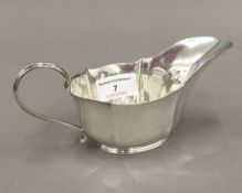 A silver sauce boat (3.
