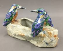 An Art Pottery vase decorated with kingfishers