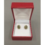 A pair of 9 ct gold and jade earrings