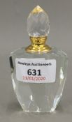 A small cut glass scent bottle