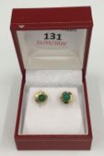 A pair of Chinese 9 ct gold and jade earrings