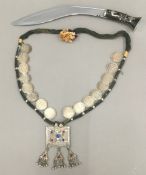 An Indian necklace set with one rupee coins,