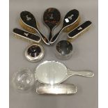 A quantity of silver and tortoiseshell mounted dressing table items