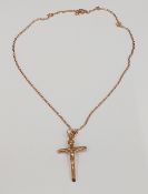 A 9 ct gold crucifix on chain (7.