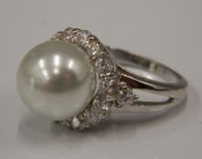 A silver cubic zirconia and pearl ring