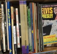 Three boxes of Elvis Presley memorabilia, including books, magazines, photos,