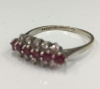 A 9 ct white gold diamond and ruby ring (2.