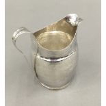 A silver cream jug (2.