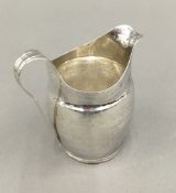 A silver cream jug (2.