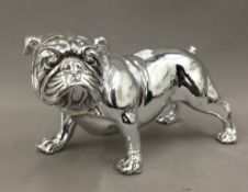 A silver coloured model of a bulldog