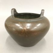 A Chinese bronze censer with ring handles