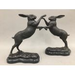 A pair of bronze boxing hares