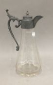 An etched clear glass claret jug