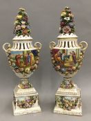 A pair of 19th century Continental porcelain pedestal urns. 56 cm high.