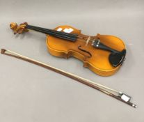 A 3/4 size Chinese violin, a label to the interior 'Lark, Shanghai, China',