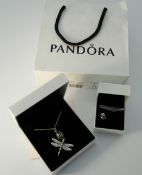 A boxed Pandora silver dragonfly pendant on chain