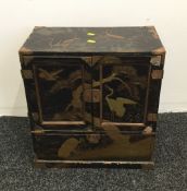 A late 19th/early 20th century Japanese lacquered table cabinet