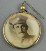 A gold mounted photo pendant