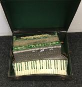 A cased Casali accordion