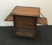 A Victorian walnut folding side table