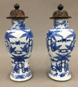 A pair of Chinese blue and white porcelain lidded vases