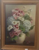 A pair of Floral Still Lifes, oil on board, unsigned, framed, 28 x 38 cm.