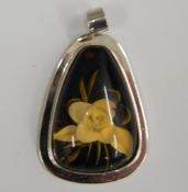 A silver flower pendant