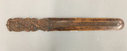 An Eastern carved wooden paperknife