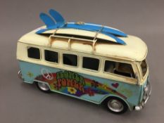 A tin plated model of a Volkswagen camper van