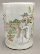 A Chinese porcelain brush pot decorated with figures