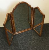 A walnut framed triptych mirror